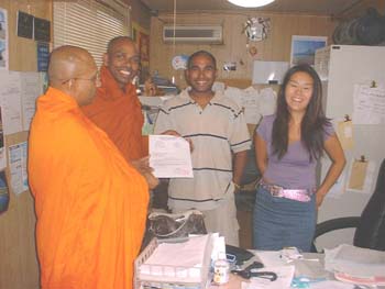 Mr Shane is hand over the letter of a car donation  to Tanzania temple..jpg